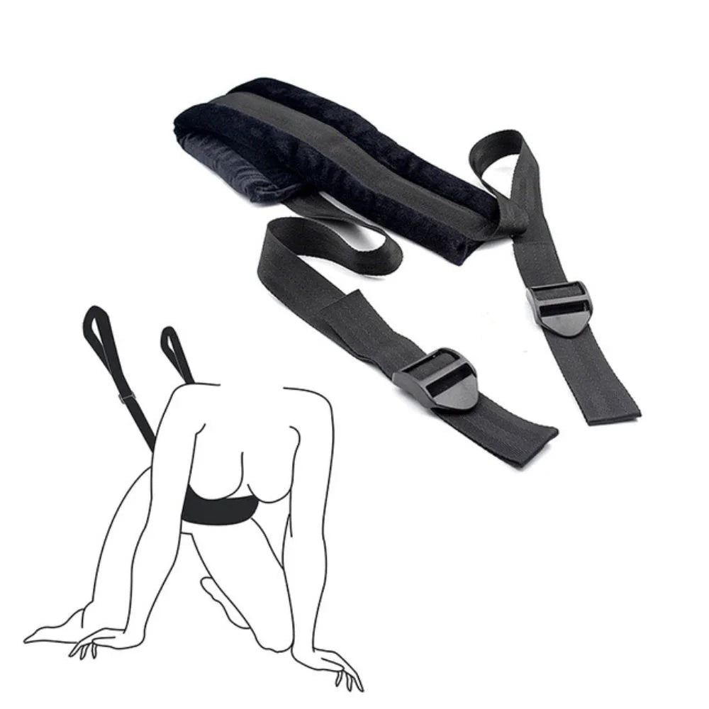 Soft material bondage positioning strap with padded support sections and adjustable straps.