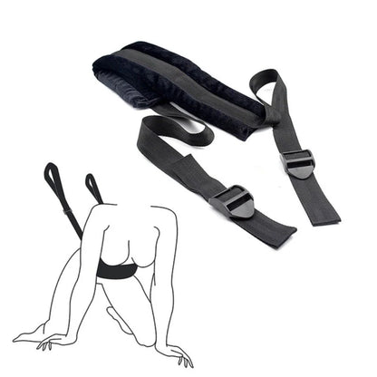 Soft material bondage positioning strap with padded support sections and adjustable straps.