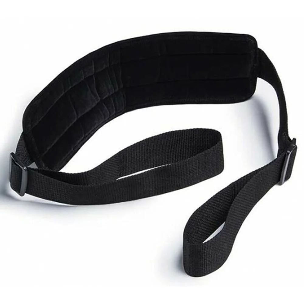 Soft material bondage positioning strap with padded support sections and adjustable straps.