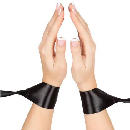 satin bed restraint system with adjustable wrist cuffs and under-bed strap