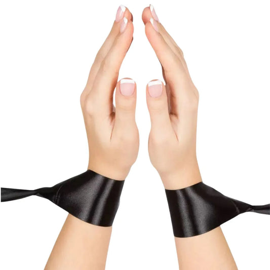 satin bed restraint system with adjustable wrist cuffs and under-bed strap