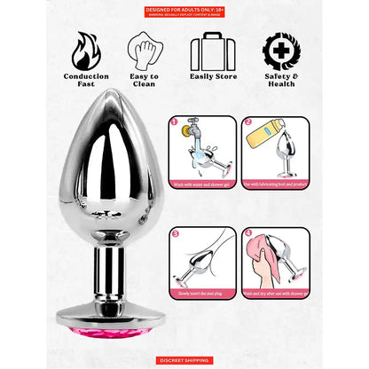 Stainless steel butt plug with mirror-polished finish and pink crystal gem base.
