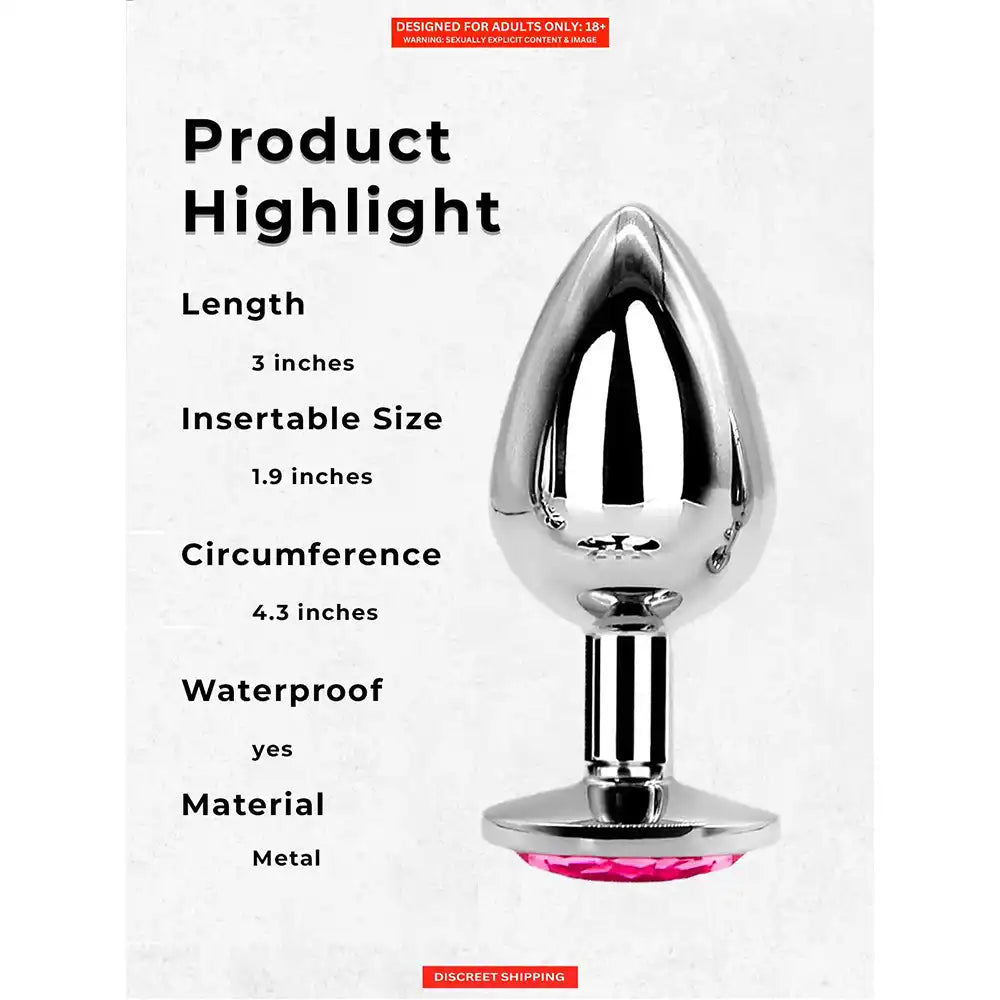 Stainless steel butt plug with mirror-polished finish and pink crystal gem base.