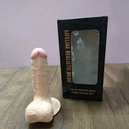 Realistic silicone massager for women with suction base and flexible body-safe silicone construction.