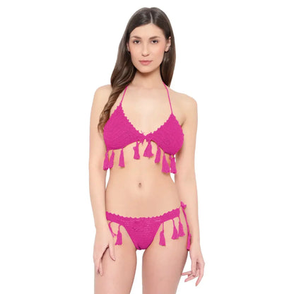 Handmade crochet bikini set with tassel tie detailing and boho beachwear styling.