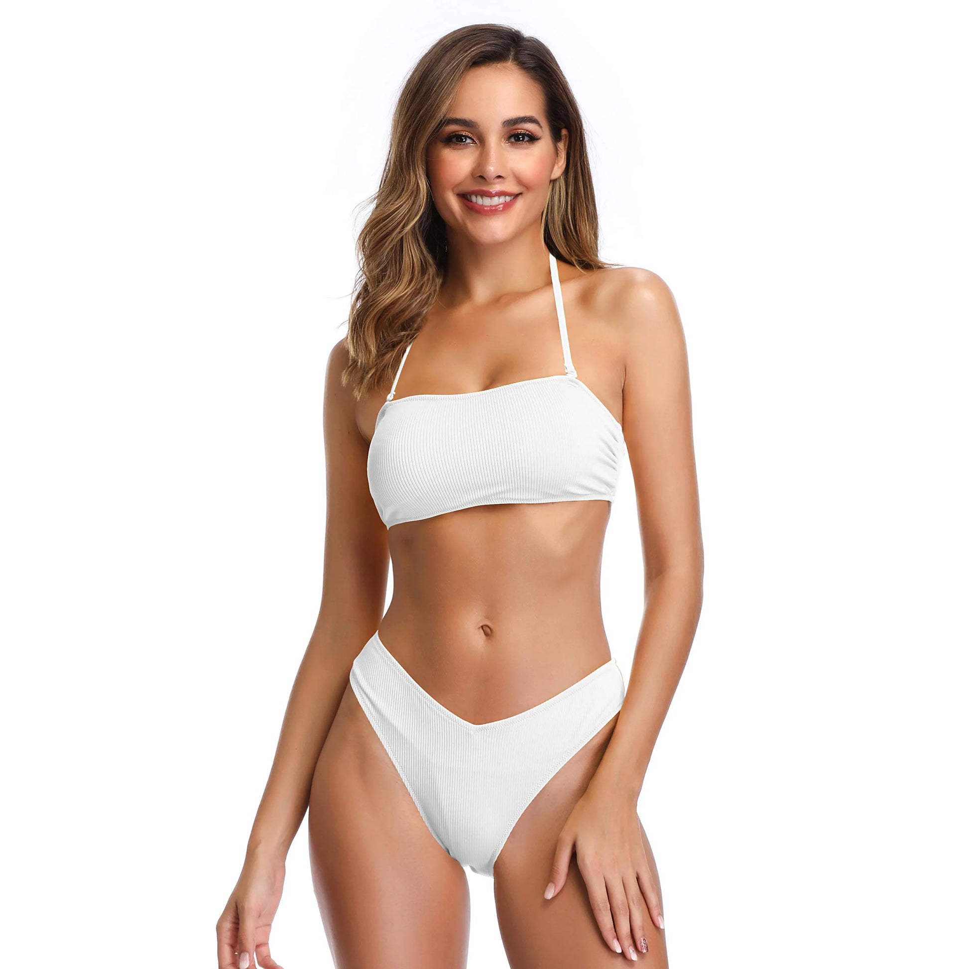 woman wearing white ribbed bandeau bikini set with high cut bottoms for elegant summer beachwear fashion