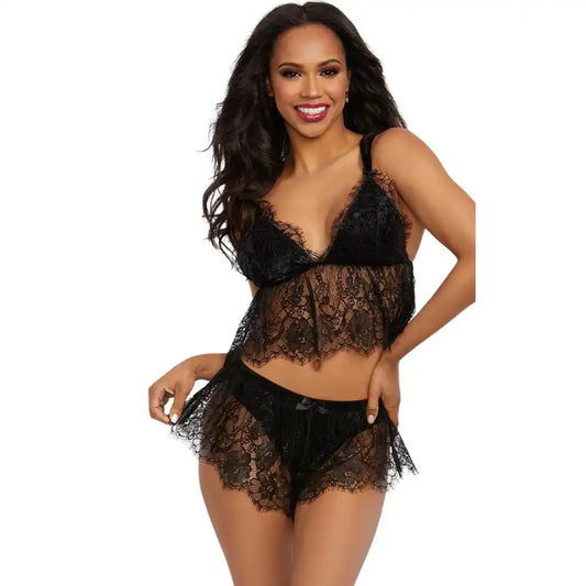 woman wearing black lace cami top and matching lace shorts lingerie set