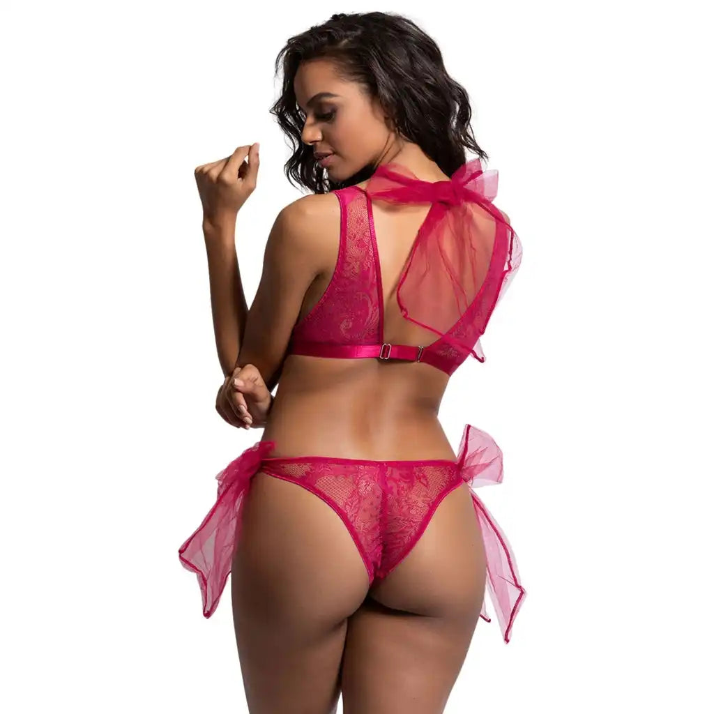 woman wearing raspberry pink sheer lace bralette and matching thong lingerie set