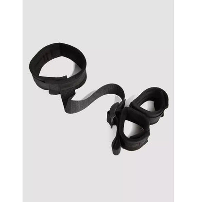 Black wrist-to-collar restraint set with padded wrist cuffs, adjustable neck collar, and connecting nylon strap.