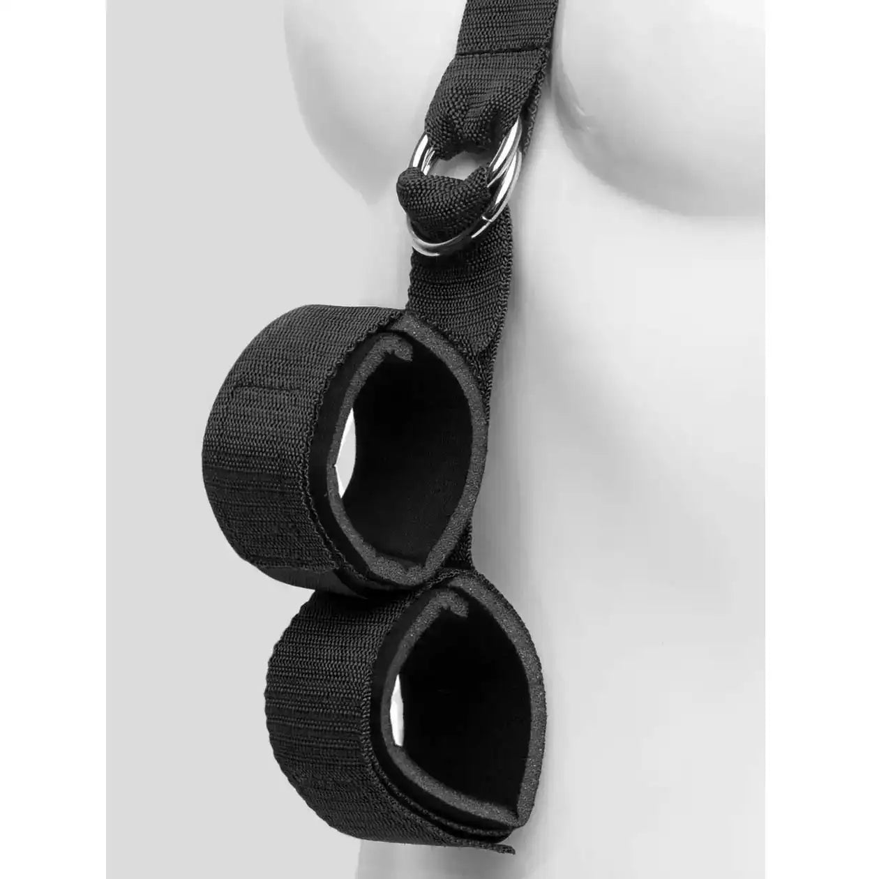 Black wrist-to-collar restraint system with padded wrist cuffs, adjustable neck collar, and connecting support strap.