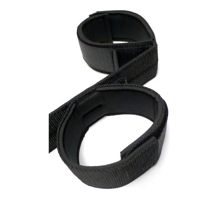 Black wrist-to-ankle restraint set with adjustable padded wrist and ankle cuffs connected by durable nylon straps.