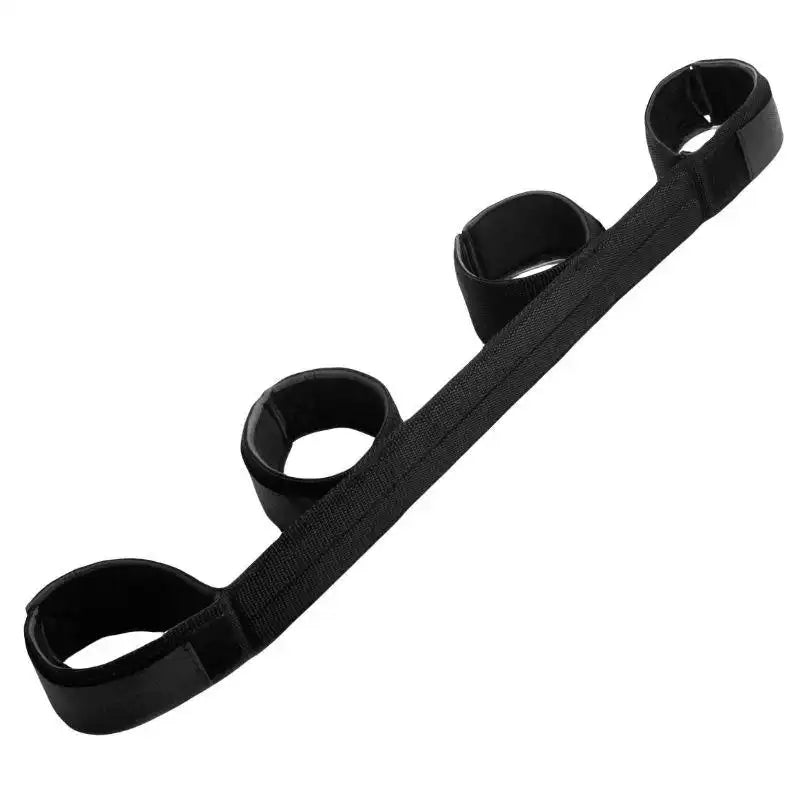 Black wrist-to-ankle position restraint strap with adjustable padded wrist and ankle cuffs connected by durable nylon webbing.